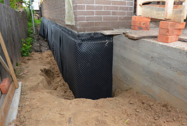 Happy homeowners after waterproofing job in Brookfield